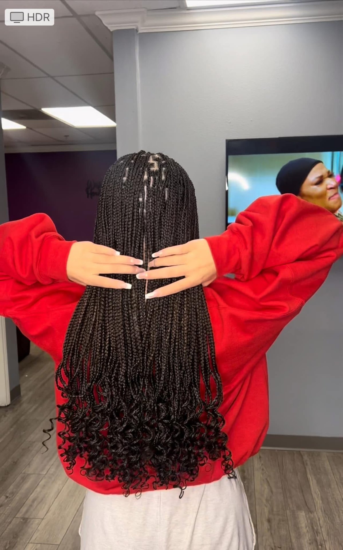 Medium knotless braids with curly ends — back view