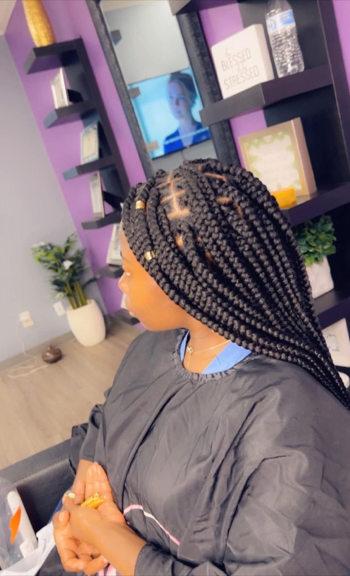 Large knotless box braids with gold cuffs